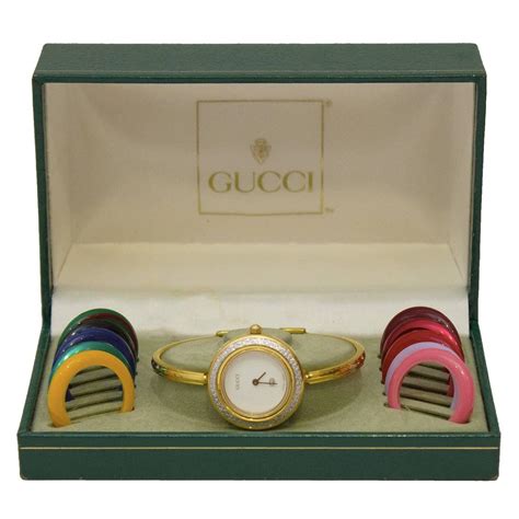 gucci watch with interchangeable bezels.